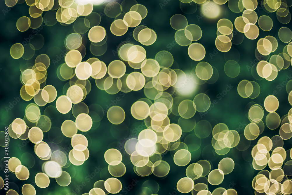 Poster Abstract blur decoration ball and light string on christmas tree with bokeh light background.winter holiday seasonal