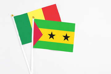 Sao Tome And Principe and Senegal stick flags on white background. High quality fabric, miniature national flag. Peaceful global concept.White floor for copy space.