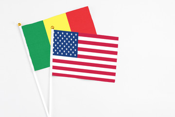 United States and Senegal stick flags on white background. High quality fabric, miniature national flag. Peaceful global concept.White floor for copy space.