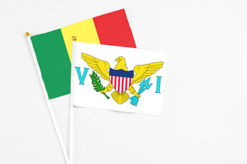 United States Virgin Islands and Senegal stick flags on white background. High quality fabric, miniature national flag. Peaceful global concept.White floor for copy space.