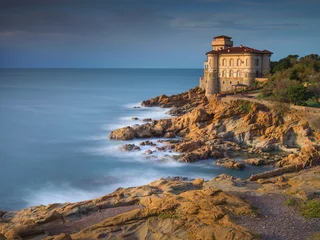 Fototapete alone castle in sunset time on the cliff in Livorno in Tuscany in Italy © sergejson