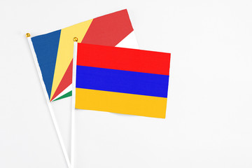 Armenia and Seychelles stick flags on white background. High quality fabric, miniature national flag. Peaceful global concept.White floor for copy space.v