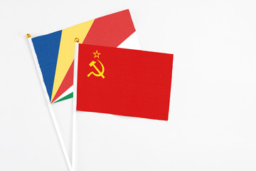 Soviet Union and Seychelles stick flags on white background. High quality fabric, miniature national flag. Peaceful global concept.White floor for copy space.v