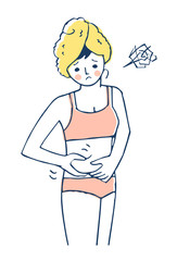 腹の贅肉をつまむ女性