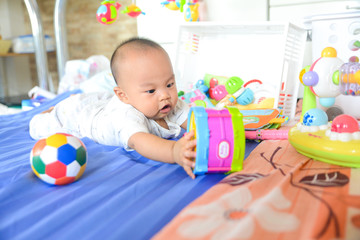 Fototapeta na wymiar Cute Asian little baby playing Toys