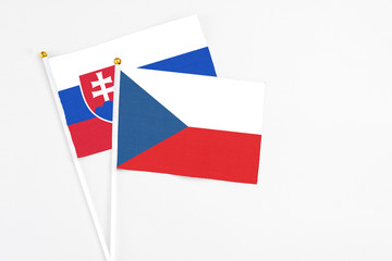 Czech Republic and Slovakia stick flags on white background. High quality fabric, miniature national flag. Peaceful global concept.White floor for copy space.