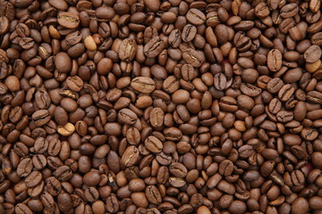 roasted coffee beans background. Arabica. Ingredient. Flat lay. Top view. Pattern, background, texture. Coffee concept. 