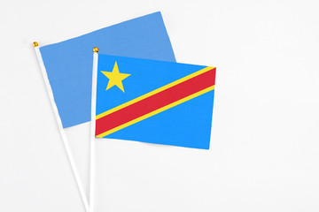 Congo and Somalia stick flags on white background. High quality fabric, miniature national flag. Peaceful global concept.White floor for copy space.