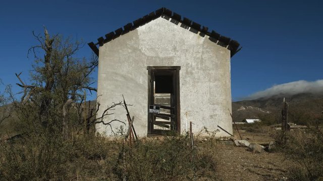 A dilapidated post office building in a tiny town