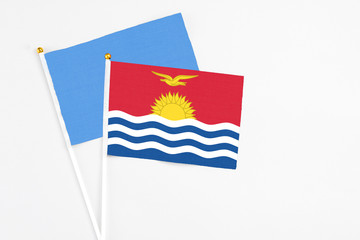 Kiribati and Somalia stick flags on white background. High quality fabric, miniature national flag. Peaceful global concept.White floor for copy space.