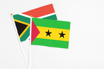 Sao Tome And Principe and South Africa stick flags on white background. High quality fabric, miniature national flag. Peaceful global concept.White floor for copy space.