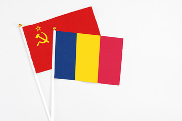 Chad and Soviet Union stick flags on white background. High quality fabric, miniature national flag. Peaceful global concept.White floor for copy space.