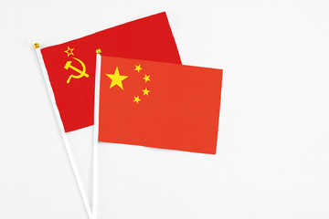 China and Soviet Union stick flags on white background. High quality fabric, miniature national flag. Peaceful global concept.White floor for copy space.
