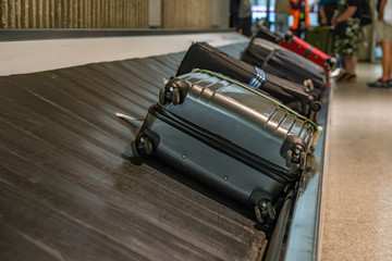 Luggage or suitcases on carousel at the airport 