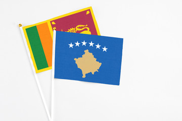 and Sri Lanka stick flags on white background. High quality fabric, miniature national flag. Peaceful global concept.White floor for copy space.