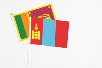 Fototapeta premium and Sri Lanka stick flags on white background. High quality fabric, miniature national flag. Peaceful global concept.White floor for copy space.