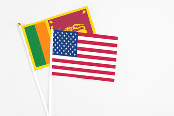 and Sri Lanka stick flags on white background. High quality fabric, miniature national flag. Peaceful global concept.White floor for copy space.