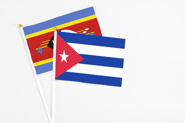 Cuba and Swaziland stick flags on white background. High quality fabric, miniature national flag....