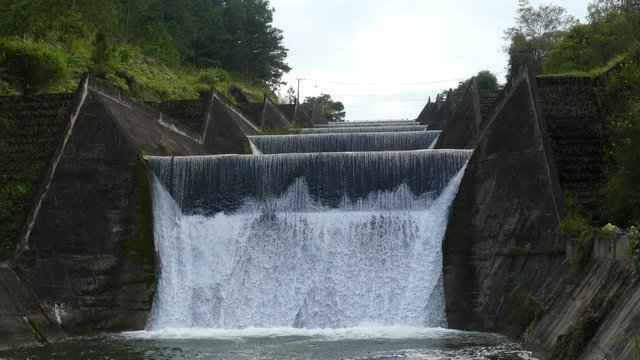 Slowmotion Artificial waterfall. Big steps waterfall, DaLat, Vietnam. Close view of waterfall and rivier. Waterfall in the forest.