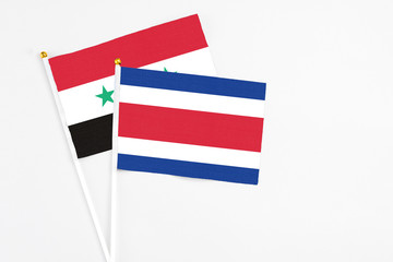 Costa Rica and Syria stick flags on white background. High quality fabric, miniature national flag....