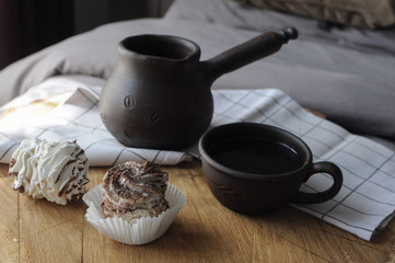 Homemade marshmallow zephyr with clay cup of coffee