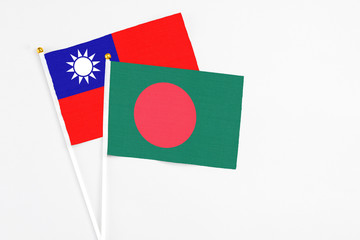 Bangladesh and Taiwan stick flags on white background. High quality fabric, miniature national flag. Peaceful global concept.White floor for copy space.