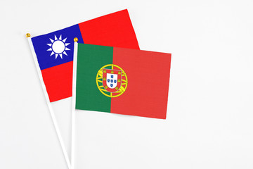 Portugal and Taiwan stick flags on white background. High quality fabric, miniature national flag. Peaceful global concept.White floor for copy space.