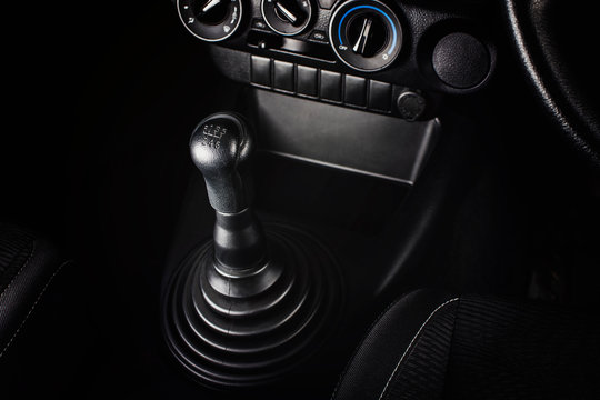 Gear stick of manual transmission of car with 6-speed and reverse position, automotive part concept.
