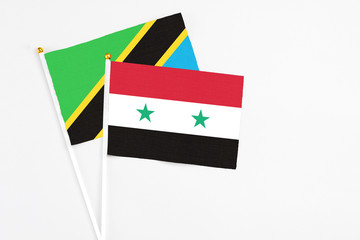 Syria and Tanzania stick flags on white background. High quality fabric, miniature national flag....