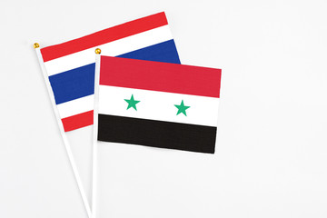 Syria and Thailand stick flags on white background. High quality fabric, miniature national flag....