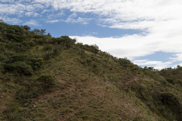 Fototapeta na wymiar panoramic view of mountain landscape and blue sky