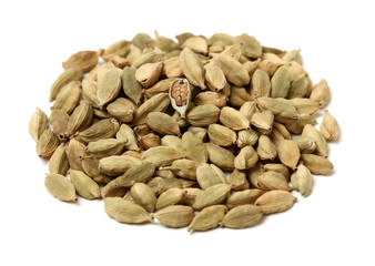 Green cardamom pods on white background