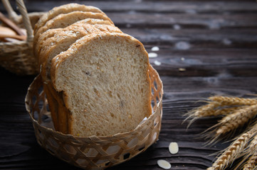Fresh homemade  baked whole grain bread and sliced bread on wooden