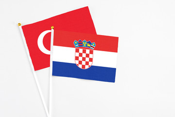 Croatia and Turkey stick flags on white background. High quality fabric, miniature national flag....