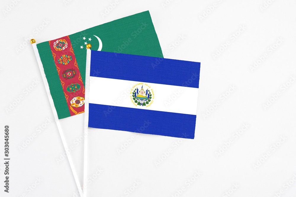 Wall mural El Salvador and Turkmenistan stick flags on white background. High quality fabric, miniature national flag. Peaceful global concept.White floor for copy space. - Wall murals