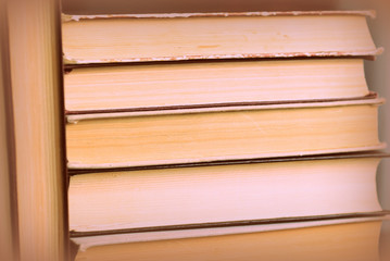 Several old books close up. Educational background retro style toned