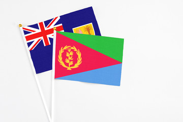 Eritrea and Turks And Caicos Islands stick flags on white background. High quality fabric, miniature national flag. Peaceful global concept.White floor for copy space.