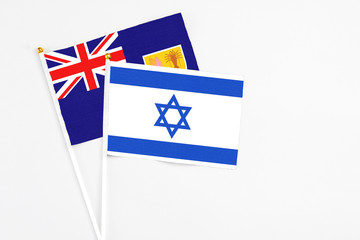 Israel and Turks And Caicos Islands stick flags on white background. High quality fabric, miniature national flag. Peaceful global concept.White floor for copy space.