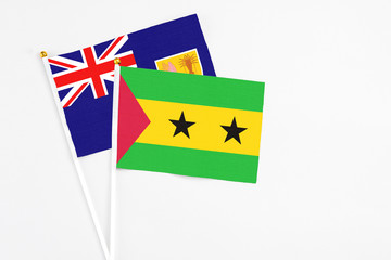 Sao Tome And Principe and Turks And Caicos Islands stick flags on white background. High quality fabric, miniature national flag. Peaceful global concept.White floor for copy space.