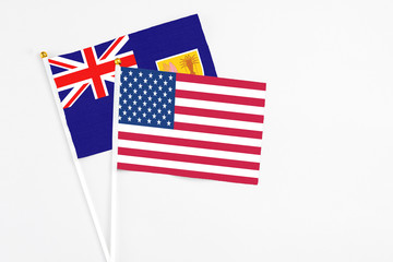 United States and Turks And Caicos Islands stick flags on white background. High quality fabric, miniature national flag. Peaceful global concept.White floor for copy space.
