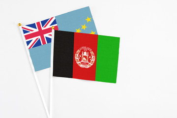 Afghanistan and Tuvalu stick flags on white background. High quality fabric, miniature national...