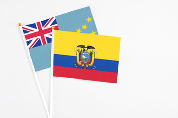 Ecuador and Tuvalu stick flags on white background. High quality fabric, miniature national flag. Peaceful global concept.White floor for copy space.