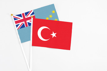 Turkey and Tuvalu stick flags on white background. High quality fabric, miniature national flag. Peaceful global concept.White floor for copy space.