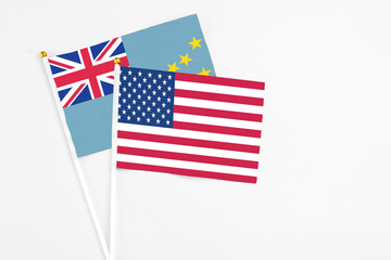 United States and Tuvalu stick flags on white background. High quality fabric, miniature national flag. Peaceful global concept.White floor for copy space.
