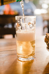 glass of light beer on the table