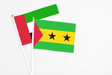 Sao Tome And Principe and United Arab Emirates stick flags on white background. High quality fabric, miniature national flag. Peaceful global concept.White floor for copy space.