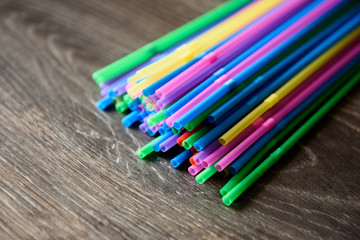 Fototapeta premium colorful plastic tubes for cocktails are on the table