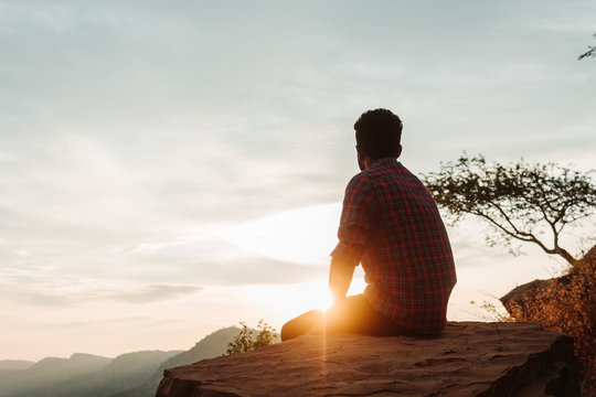 Indian Male Model Sitting In Front Of The Sunset At Kalo Dungar In Kutch, Gujarat, India