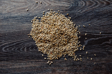 peeled sunflower seeds on a dark background