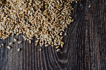 peeled sunflower seeds on a dark background